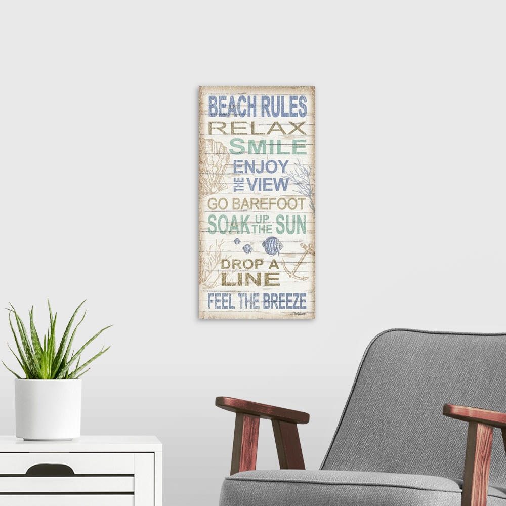 A modern room featuring Beach themed decor with a set of beach rules written on a white wooden background with various un...