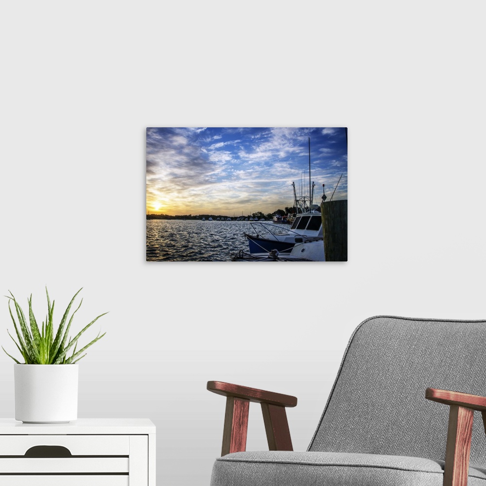 A modern room featuring Landscape photograph of boats docked in a marina at sunrise in Beaufort, SC.