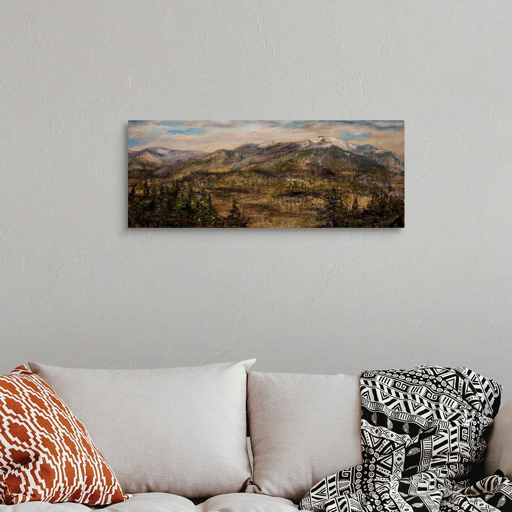 A bohemian room featuring Contemporary painting of a mountainous landscape in Montana.