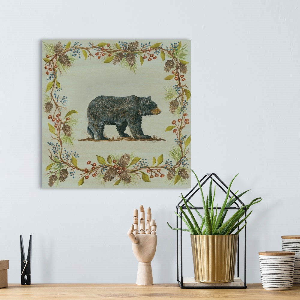A bohemian room featuring Square decorative painting of a black bear on a blue-green background with a leafy frame with ber...