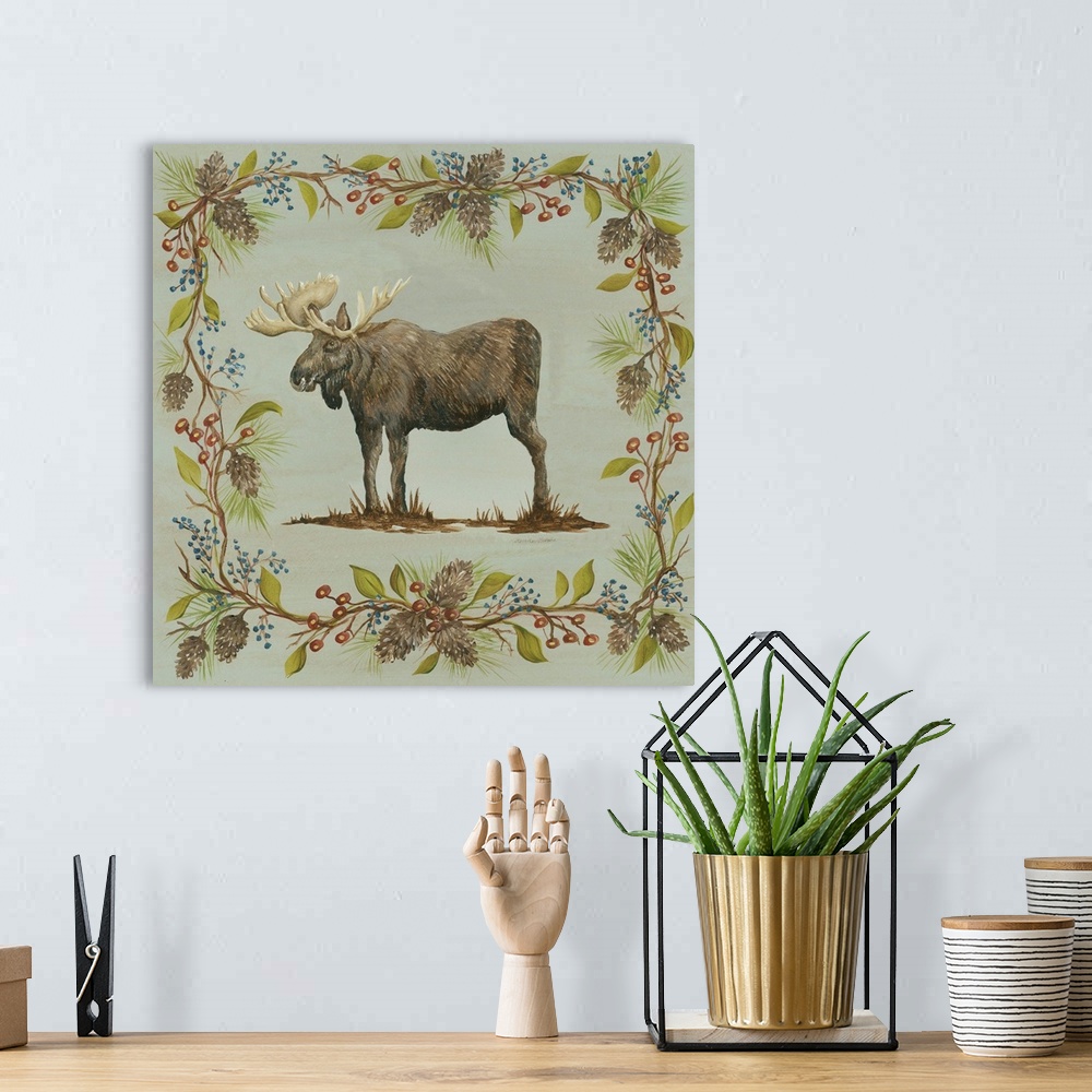 A bohemian room featuring Square decorative painting of a moose on a blue-green background with a leafy frame with berries ...