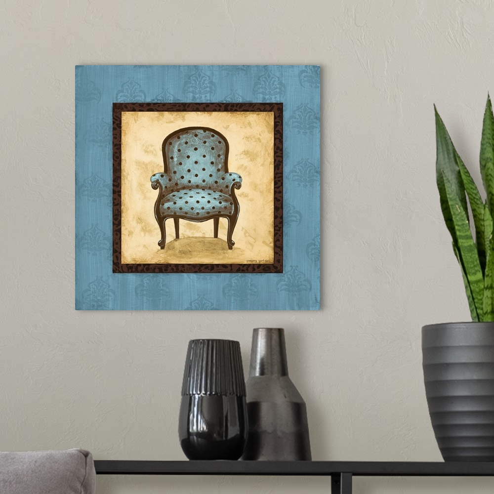 A modern room featuring Square painting with a blue and brown polka dotted chair in the center with a tan background and ...