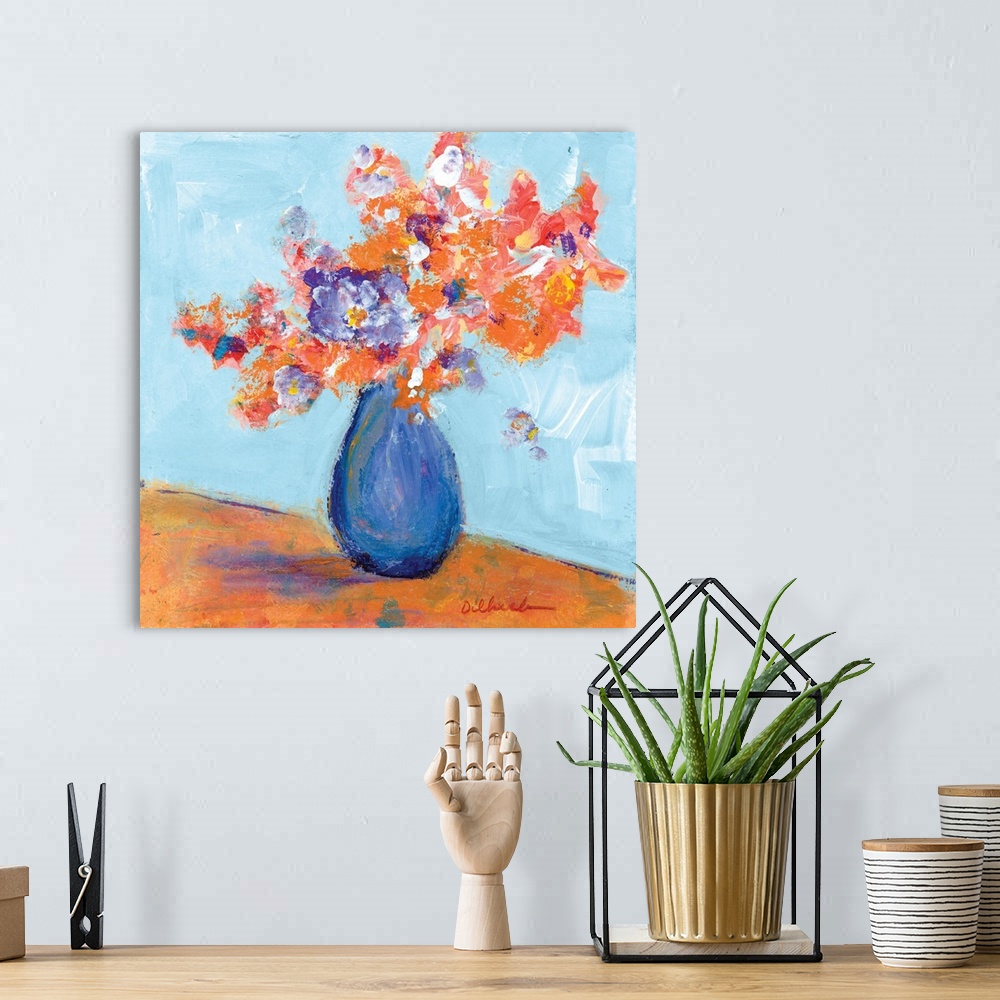 A bohemian room featuring Square painting of a bouquet of flowers in a blue vase.