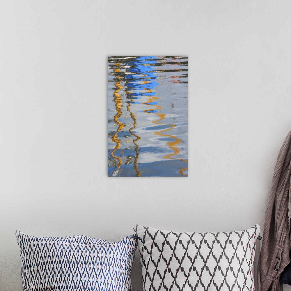 A bohemian room featuring Reflection of a boat on rippling water, creating an abstract image.