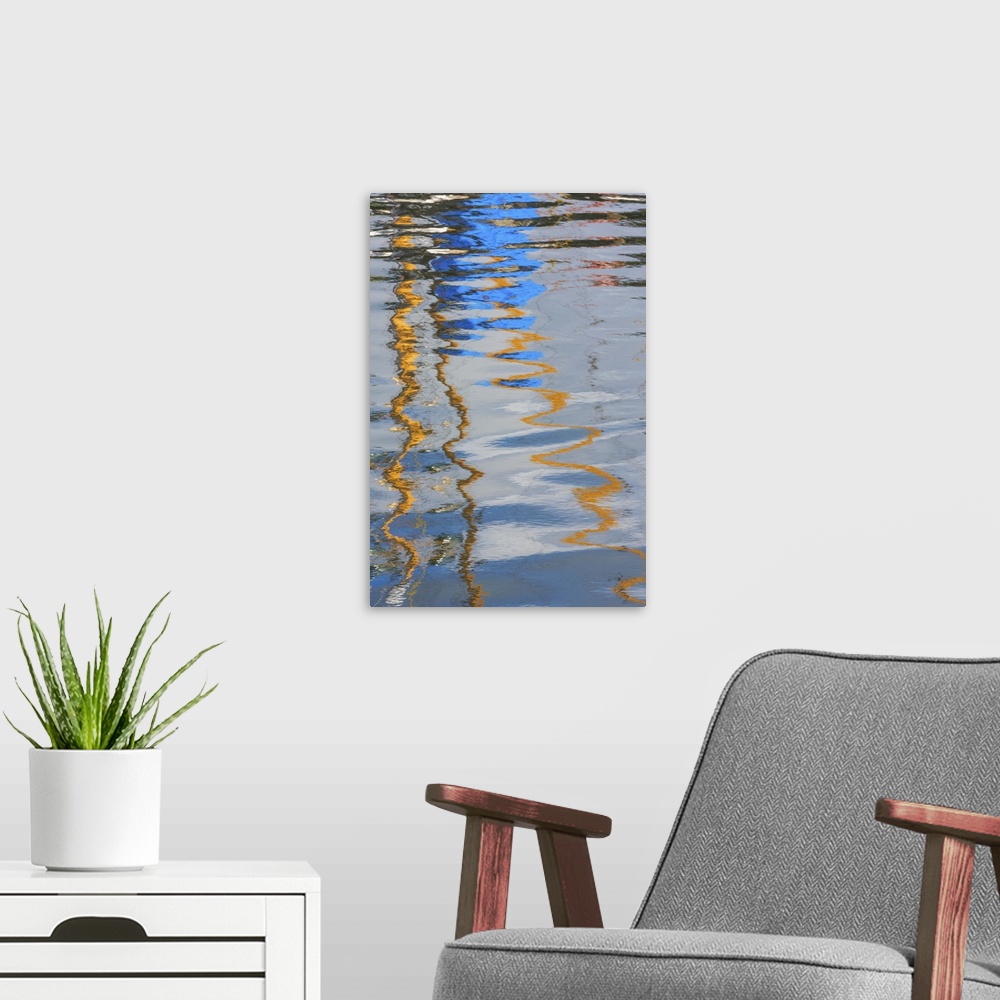 A modern room featuring Reflection of a boat on rippling water, creating an abstract image.