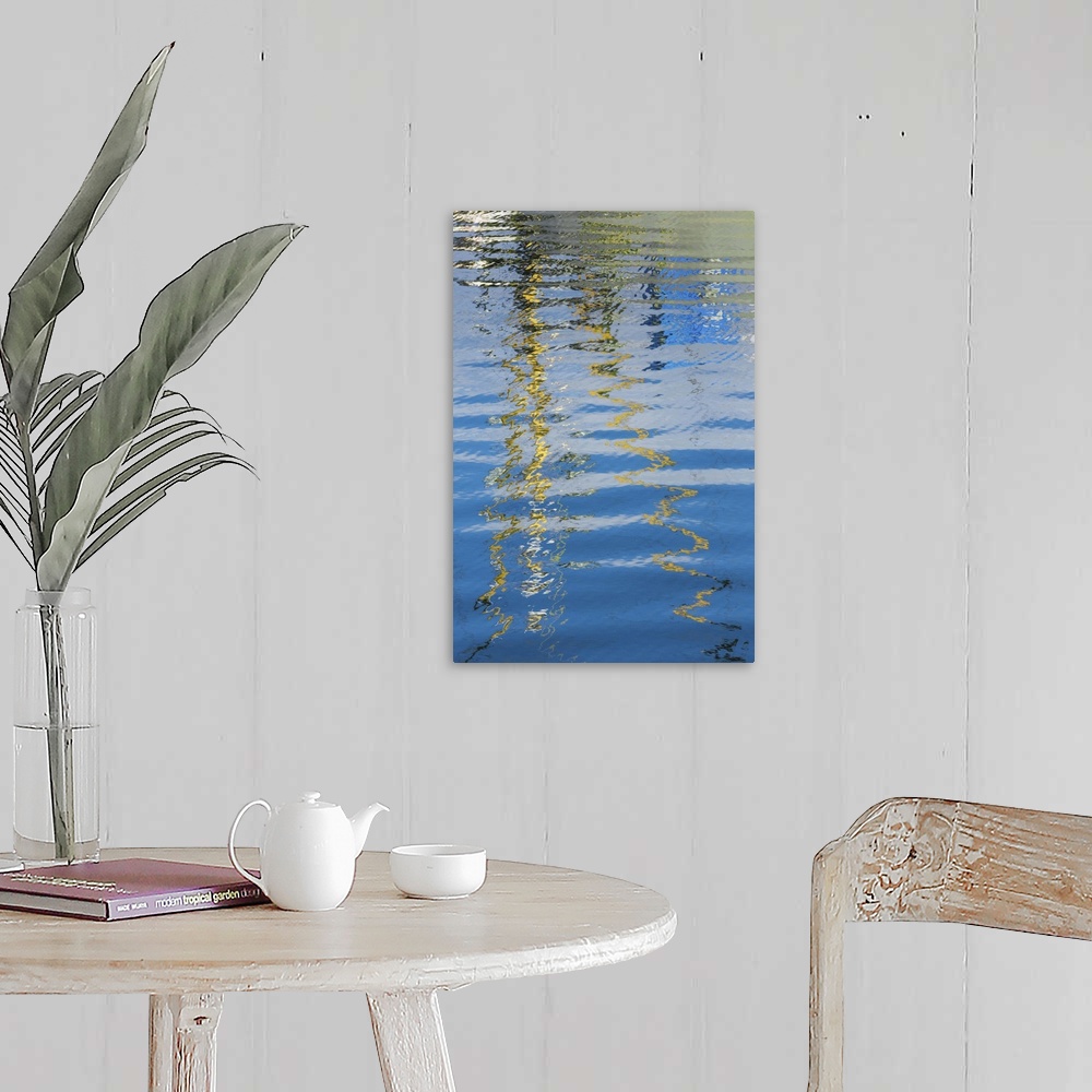 A farmhouse room featuring Reflection of a boat on rippling water, creating an abstract image.