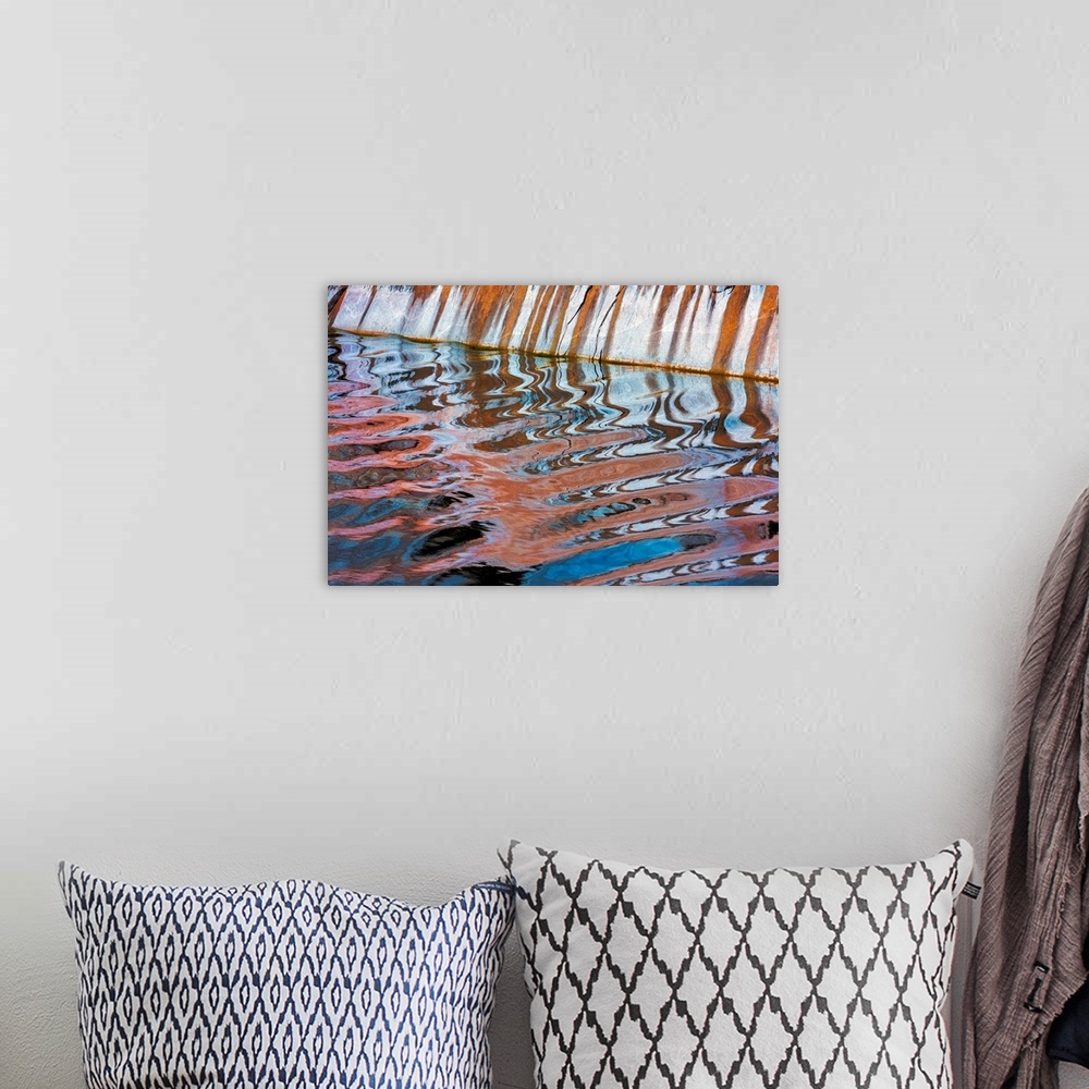 A bohemian room featuring An abstract photograph created by natural reflections in rippling water.