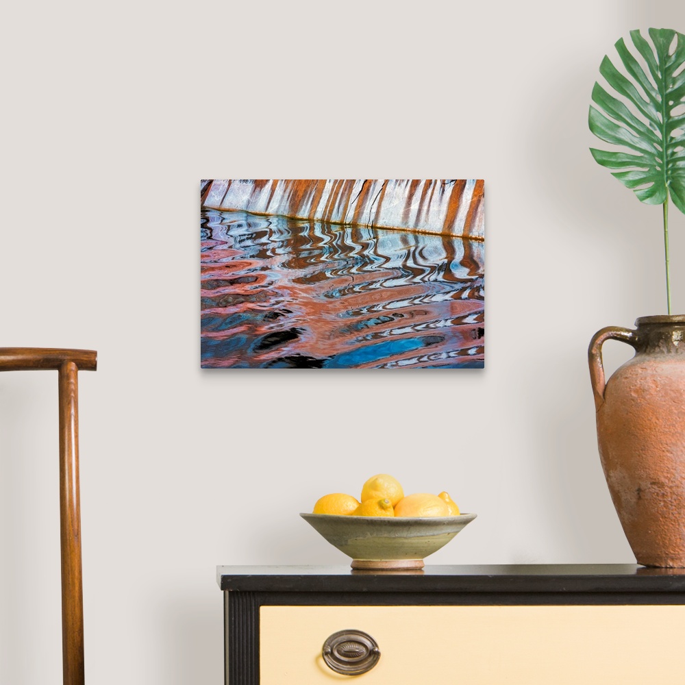 A traditional room featuring An abstract photograph created by natural reflections in rippling water.