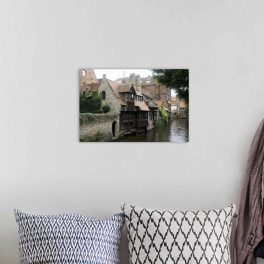 A bohemian room featuring Photograph of old houses on the edge of the river in Belgium.