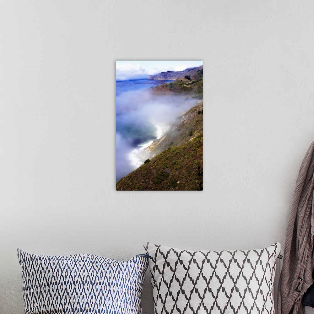A bohemian room featuring Photograph of fog rolling in off the California Big Sur ocean hitting the cliffs of the mountains...