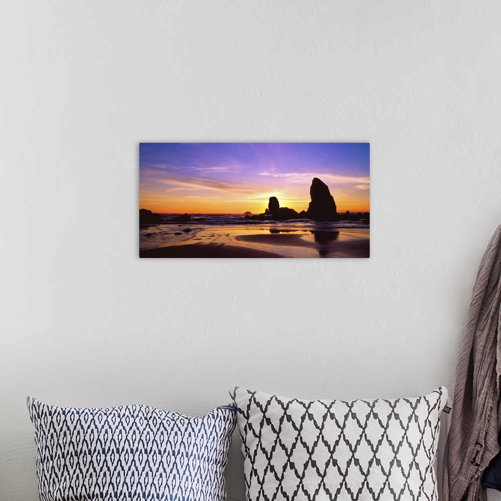 A bohemian room featuring Sunset over the sea stacks at Cannon Beach, Oregon.