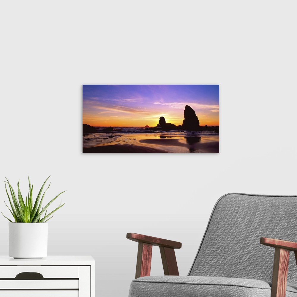 A modern room featuring Sunset over the sea stacks at Cannon Beach, Oregon.