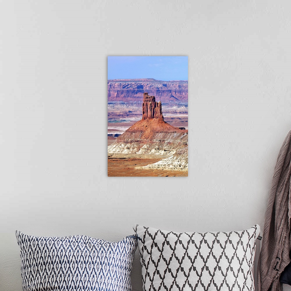 A bohemian room featuring A tall rock formation in the desert landscape of Utah.