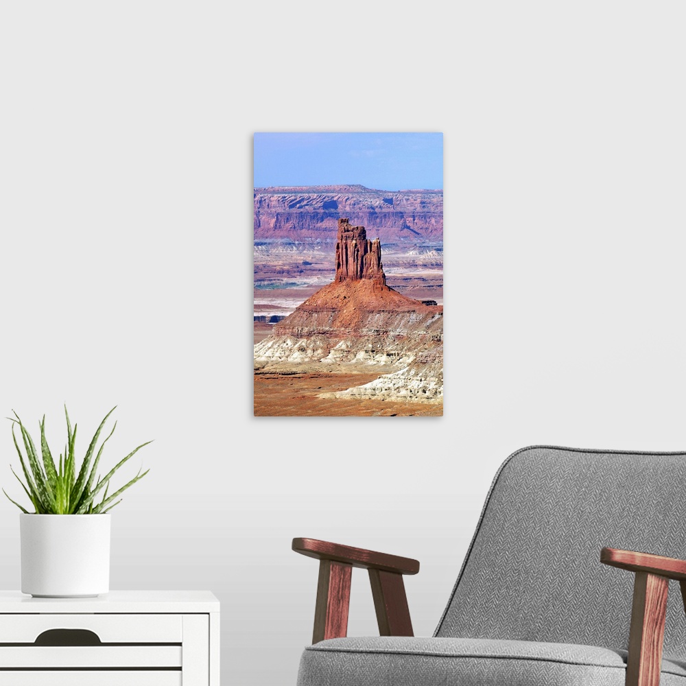 A modern room featuring A tall rock formation in the desert landscape of Utah.