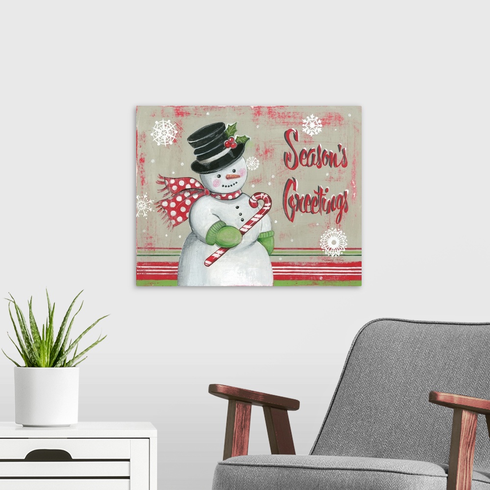 A modern room featuring Snowman holiday decor that reads "Season's Greetings" on the side.
