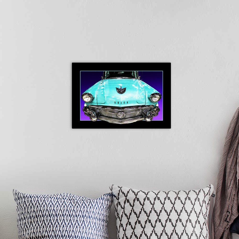 A bohemian room featuring The headlights and grill of a teal blue muscle car with a faux black border.