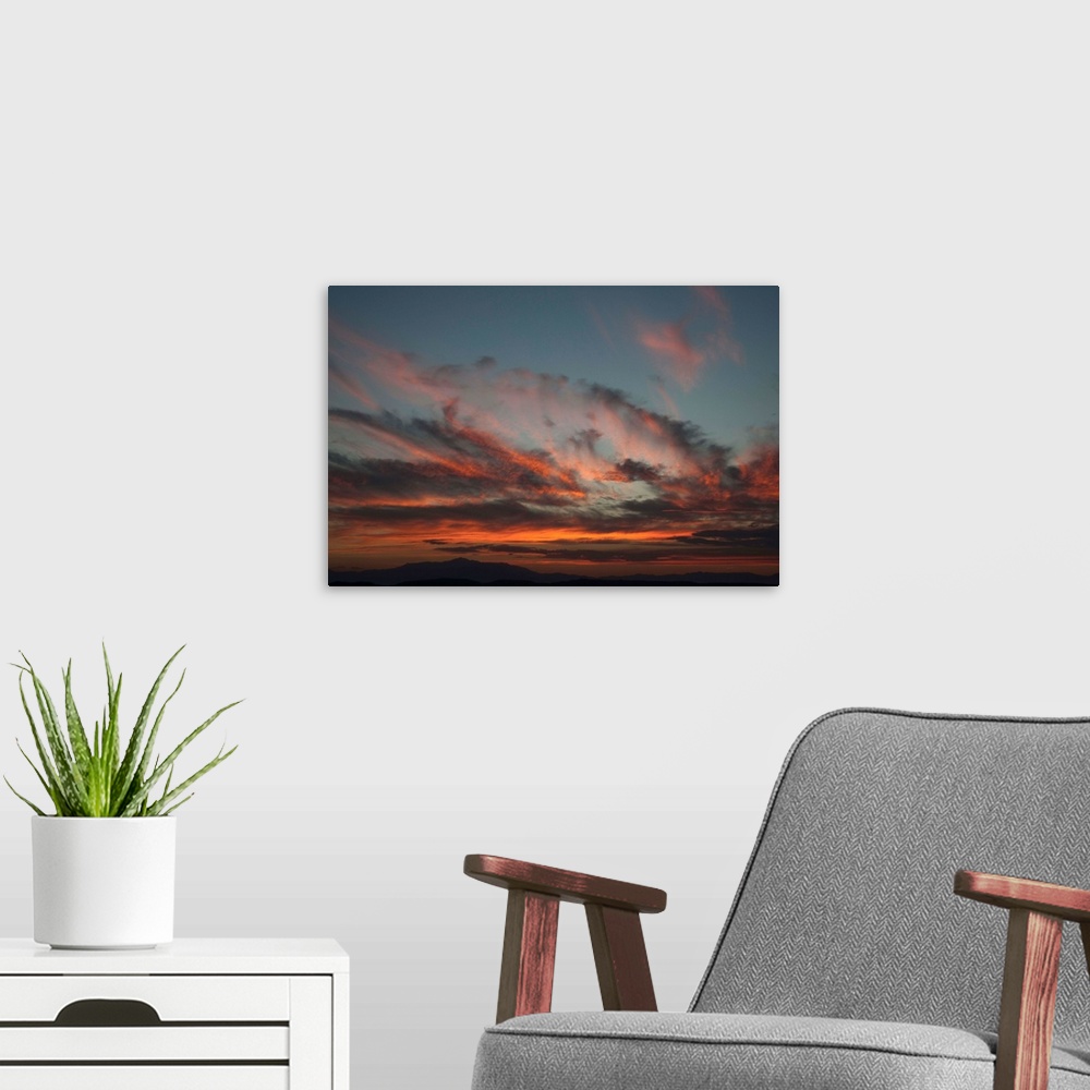 A modern room featuring Cloudy Sunset I