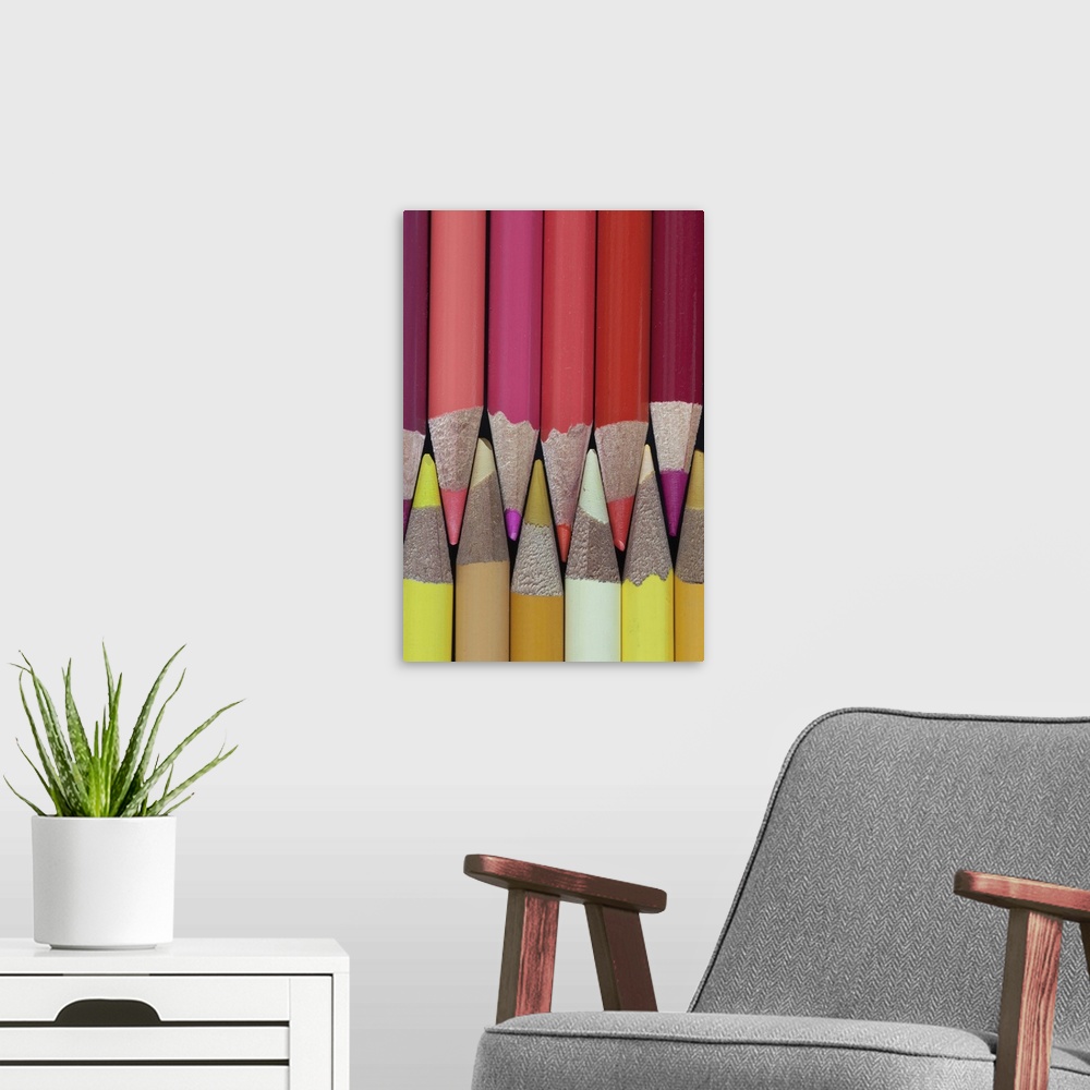 A modern room featuring Colored Pencils - shades of reds; golds and yellows