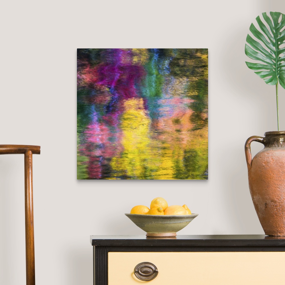 A traditional room featuring Reflections of a colorful forest in rippling water, creating an abstract image.