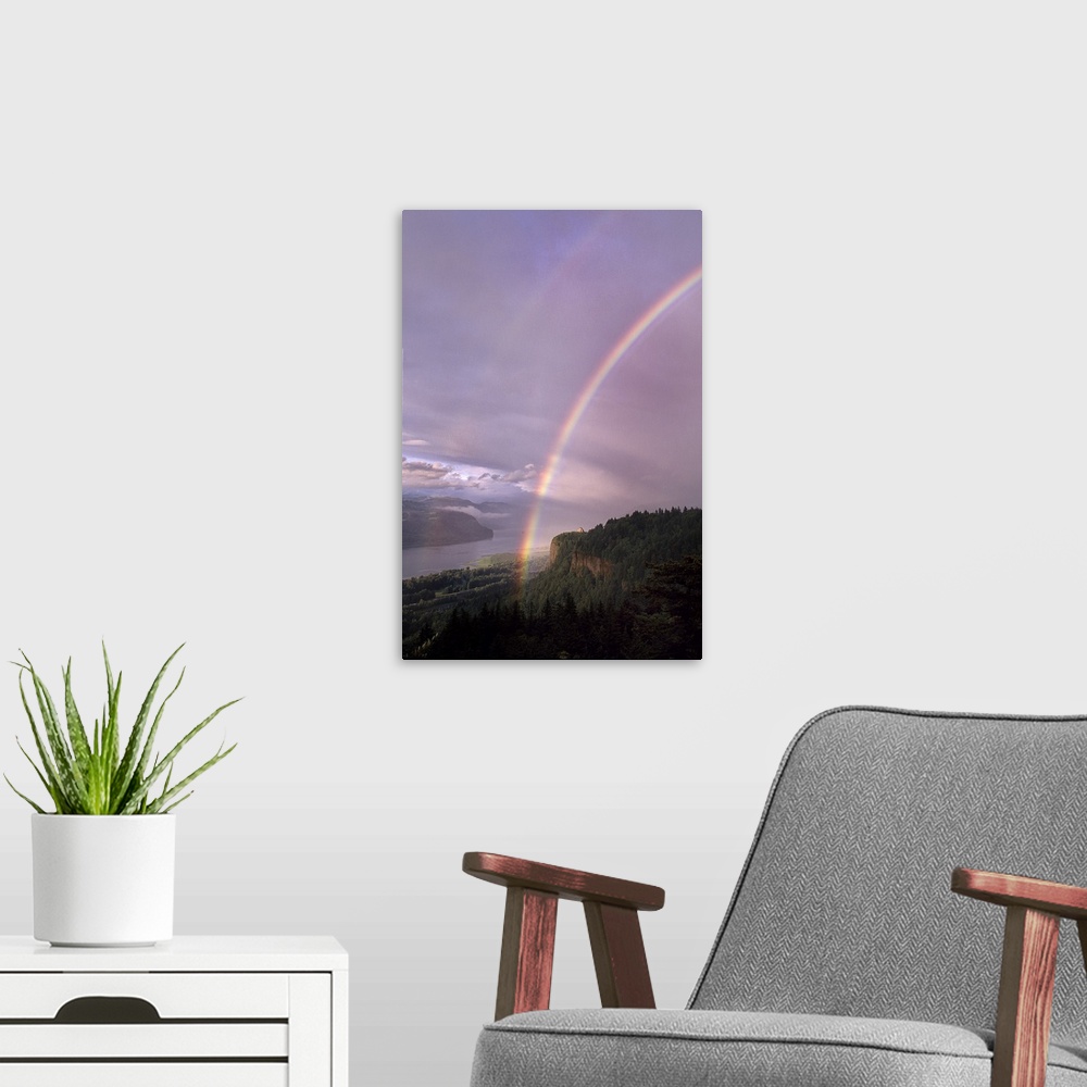 A modern room featuring A rainbow across a pastel lavender sky over the Columbia River Gorge.