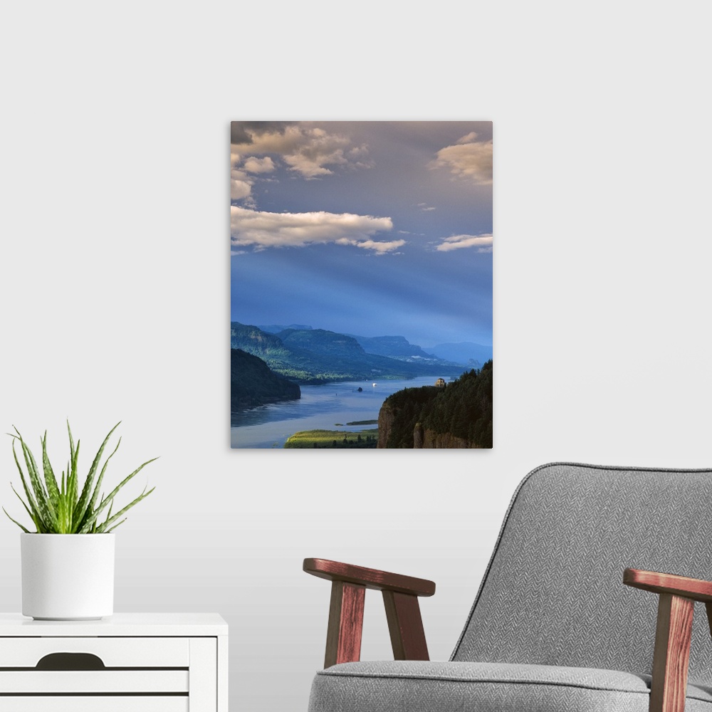 A modern room featuring A bright blue sky with clouds over the Columbia River Gorge.