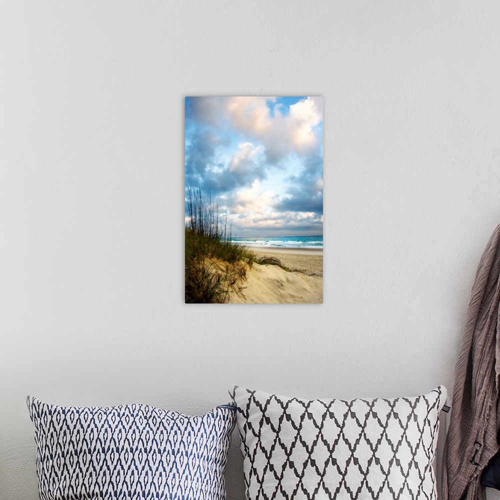 A bohemian room featuring Giant photograph taken of an ocean as it gently crashes into the sandy beach on a sunny day.  Loc...