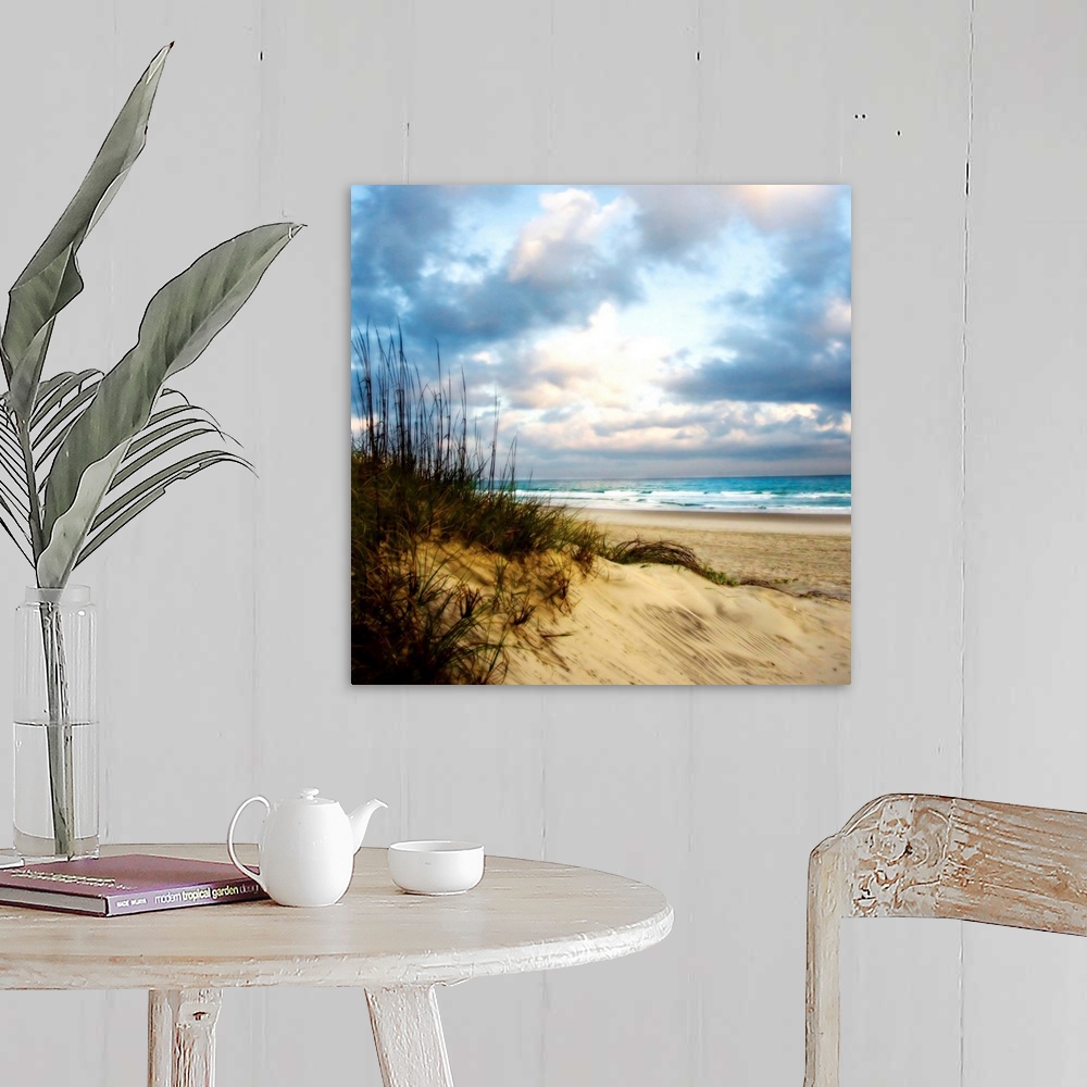 A farmhouse room featuring Soft focus fine art photo of sand dune covered in reeds on the beach as blue water crashes on the...