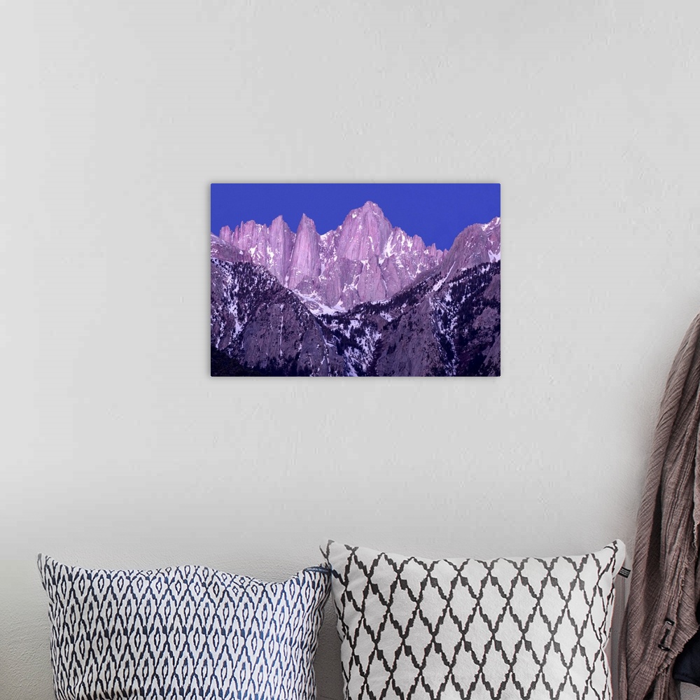 A bohemian room featuring Purple and blue toned photograph of rocky mountain peaks on Mt. Whitney at sunrise.