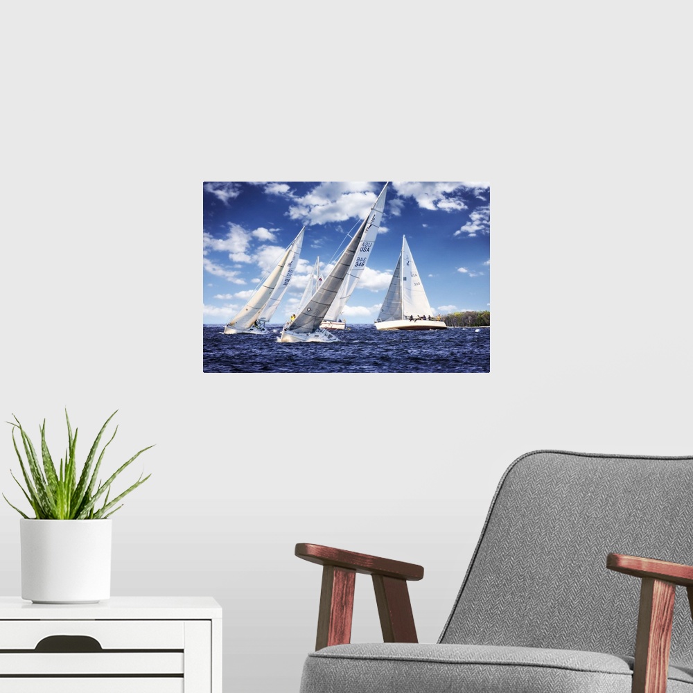 A modern room featuring Three white sailboats on the water under a cloudy blue sky.
