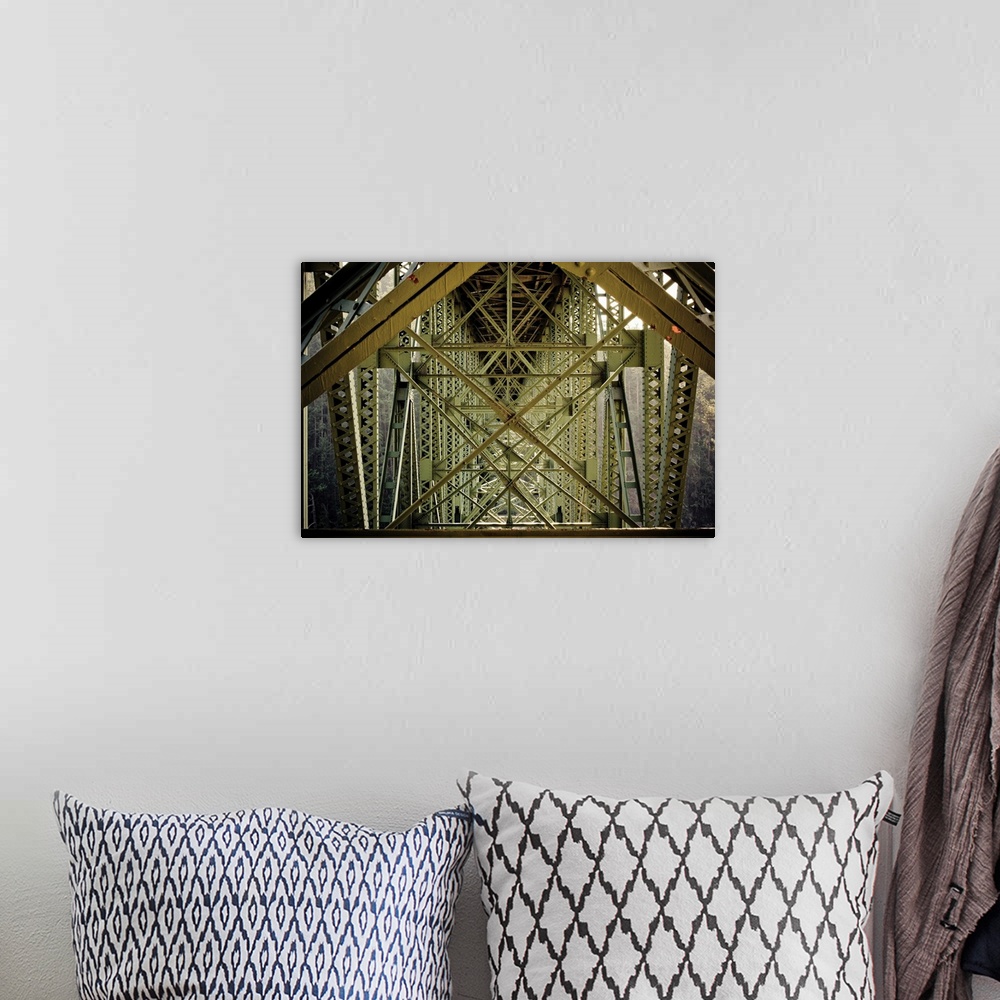 A bohemian room featuring Up-close photograph of architectural detail of iron bridge.