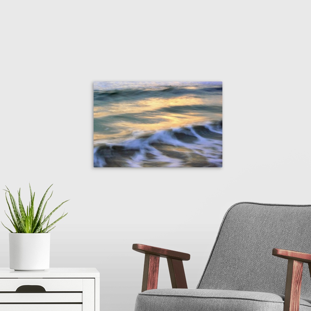 A modern room featuring This picture is taken softly out of focus of small waves that are beginning to curl near the coast.