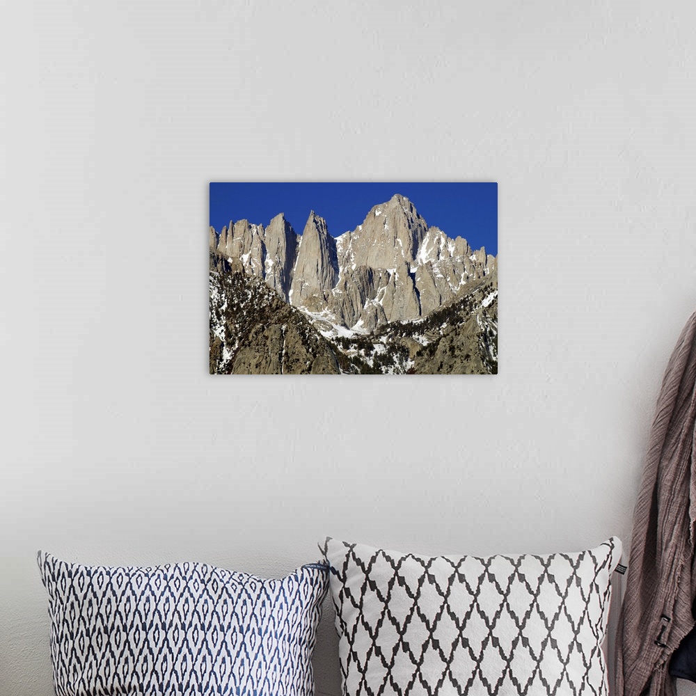 A bohemian room featuring Photograph of Mount Whitney's sharp and rocky peaks.