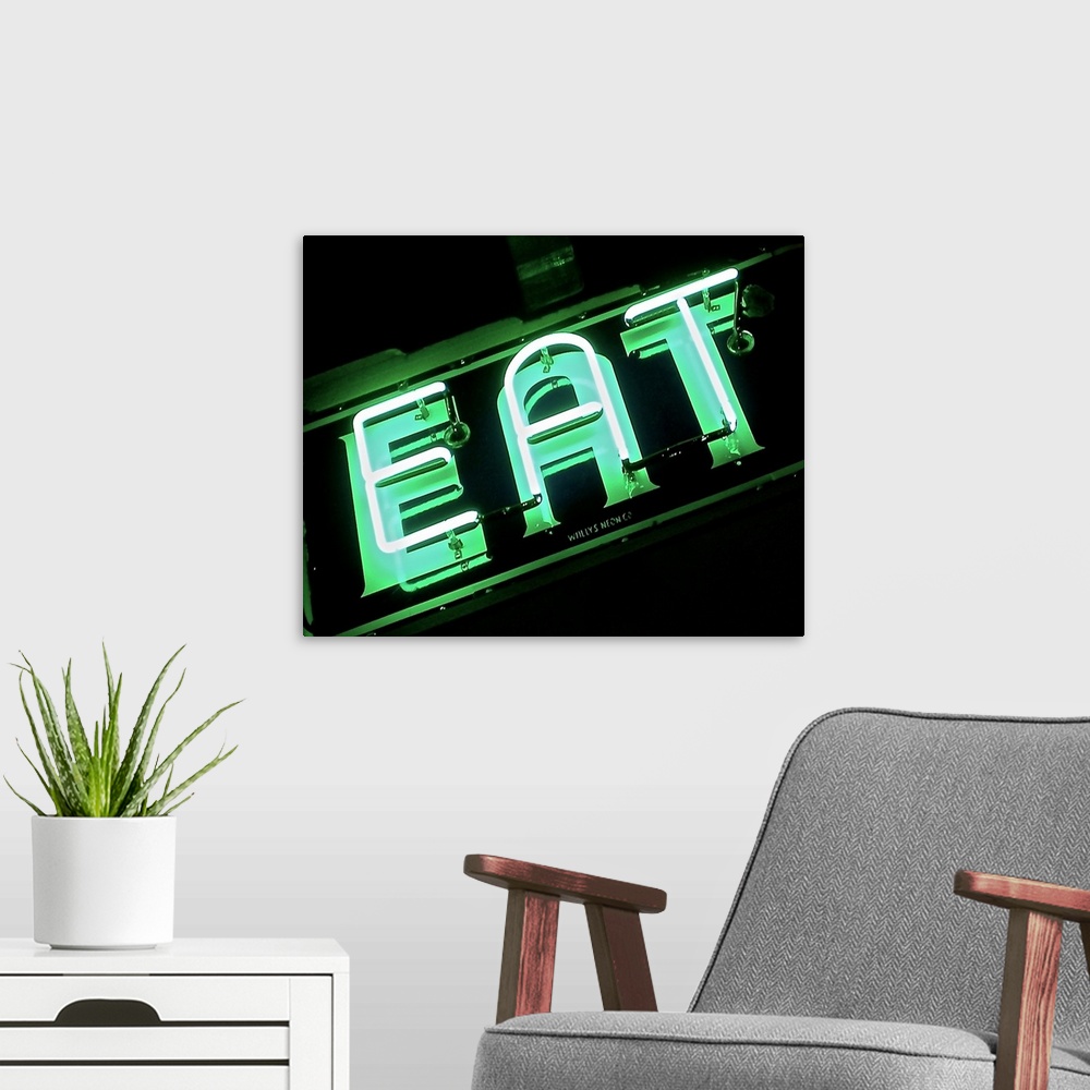 A modern room featuring Photograph of a green neon sign lit up at night that reads "EAT"