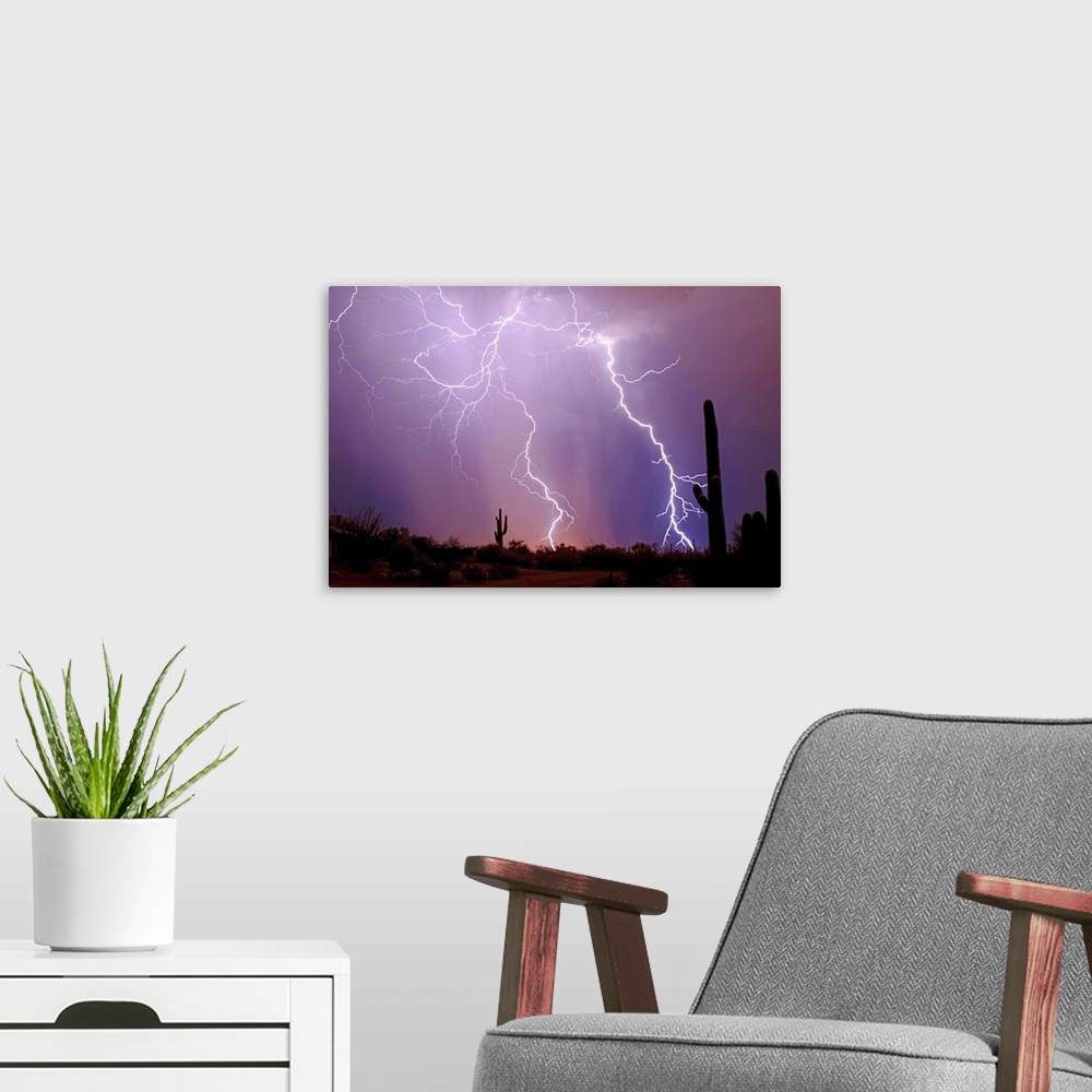 A modern room featuring Photograph of lightning bolts in a purple sky with a desert silhouette in the foreground.
