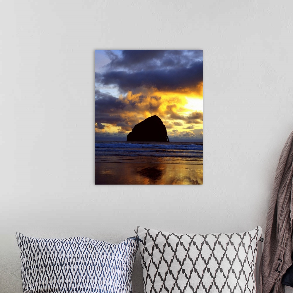 A bohemian room featuring Silhouette photograph of a rock formation in the middle of the ocean with a colorful sunset in Or...