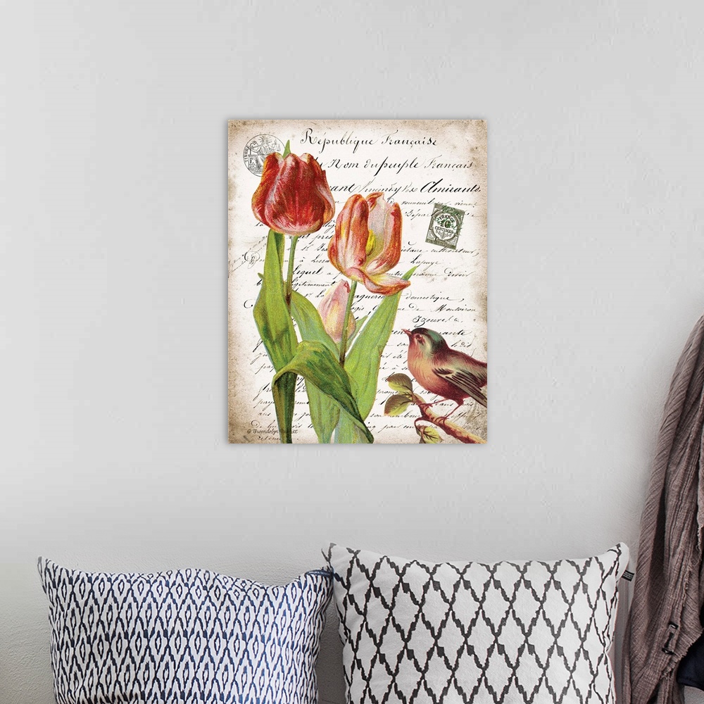 A bohemian room featuring Vintage art with three tulips and a bird on top of an old letter written in French.