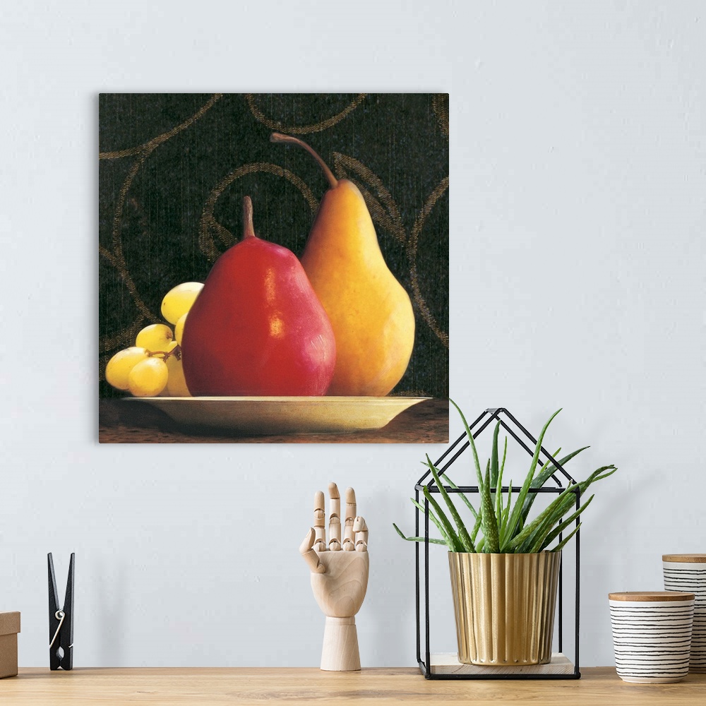 A bohemian room featuring Two pears and a bunch of grapes on a plate with a wallpapered background.