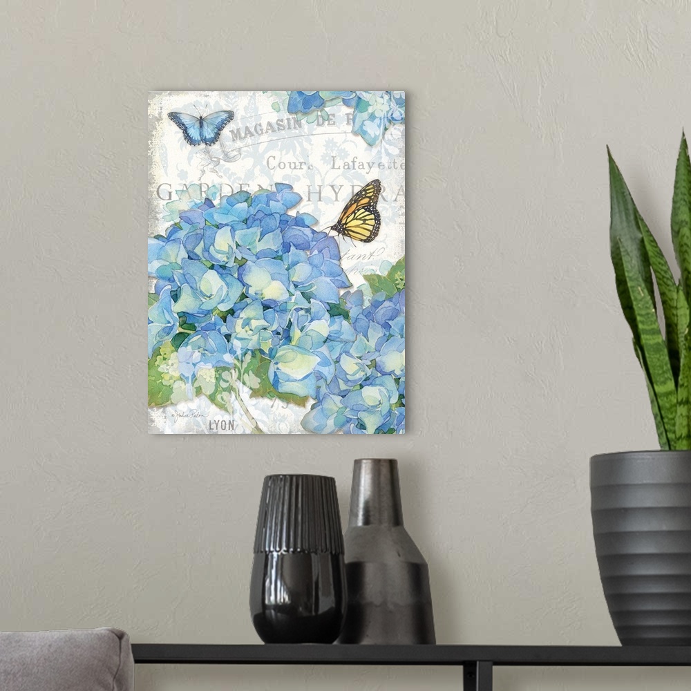 A modern room featuring Bundles of blue hydrangeas with two butterflies on a decorative background with grey text.