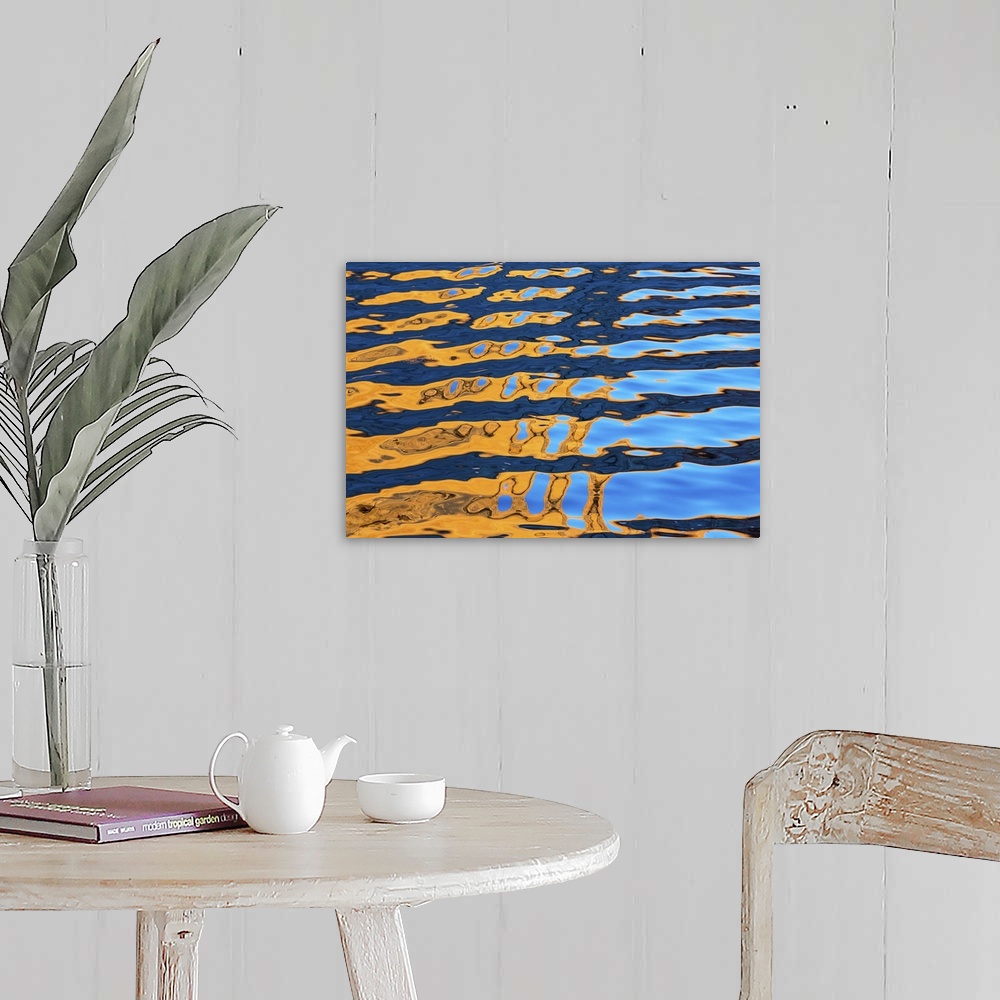 A farmhouse room featuring An abstract photograph created by natural reflections in rippling water.