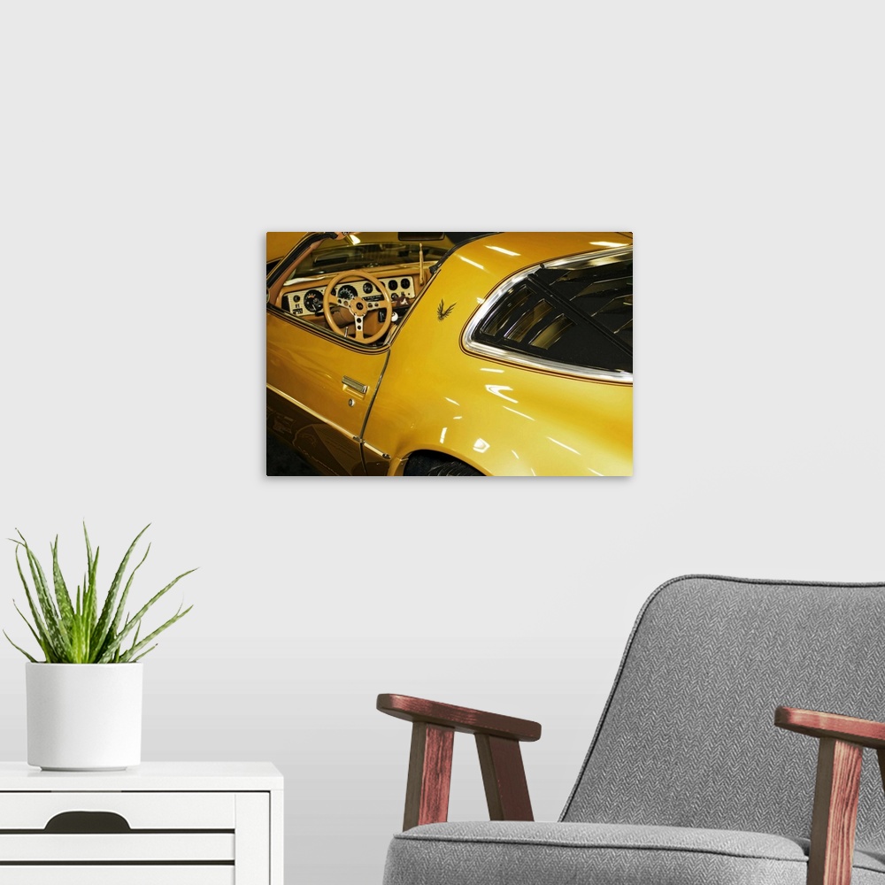 A modern room featuring Fine art photograph of a vintage car. The interior and steering wheel are visible.