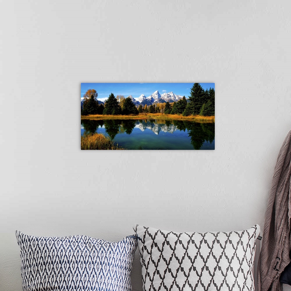 A bohemian room featuring Panoramic view of the Grand Tetons reflected in a lake in Wyoming.