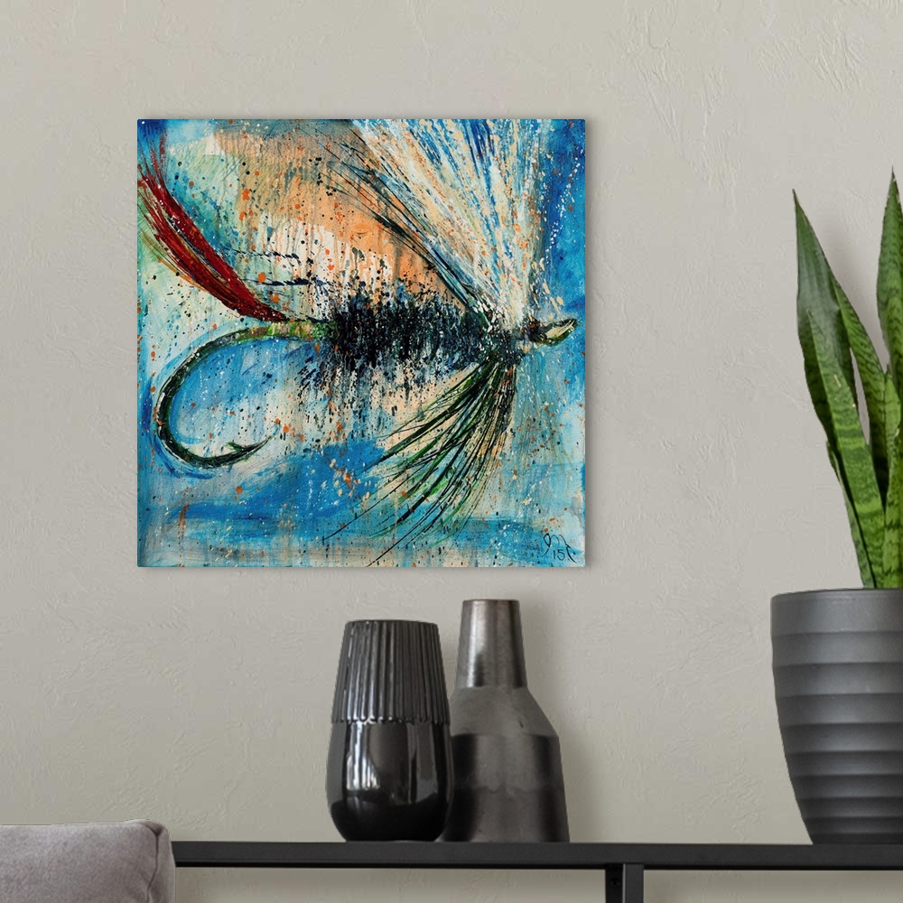 A modern room featuring Square painting of a green, red, and white fly fishing lure on a blue background with orange pain...