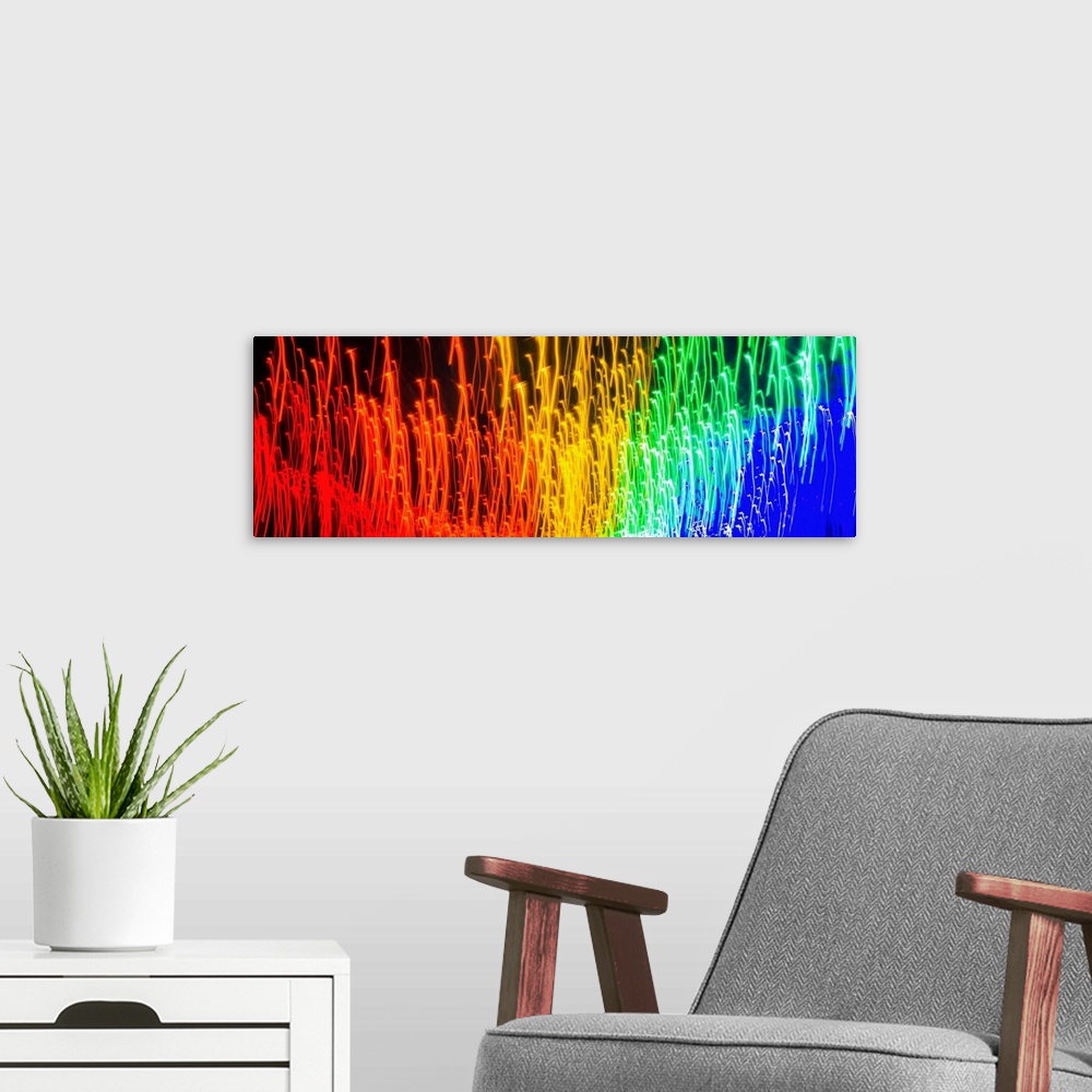 A modern room featuring Panoramic abstract photograph of rainbow light trails.