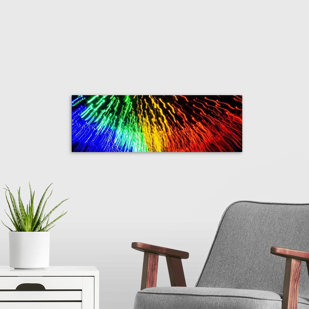 A modern room featuring Panoramic abstract photograph of rainbow light trails.