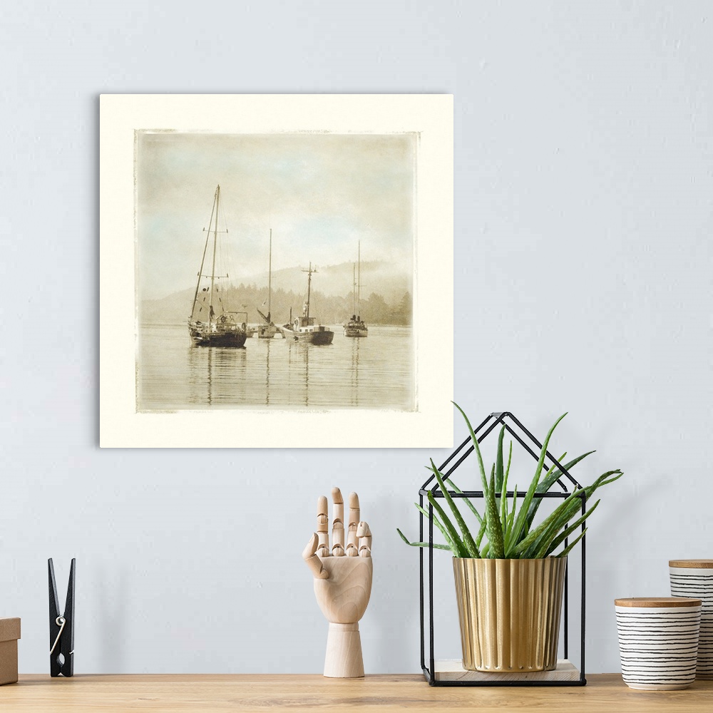 A bohemian room featuring Painting of sailboats sitting calmly in the harbor waters.