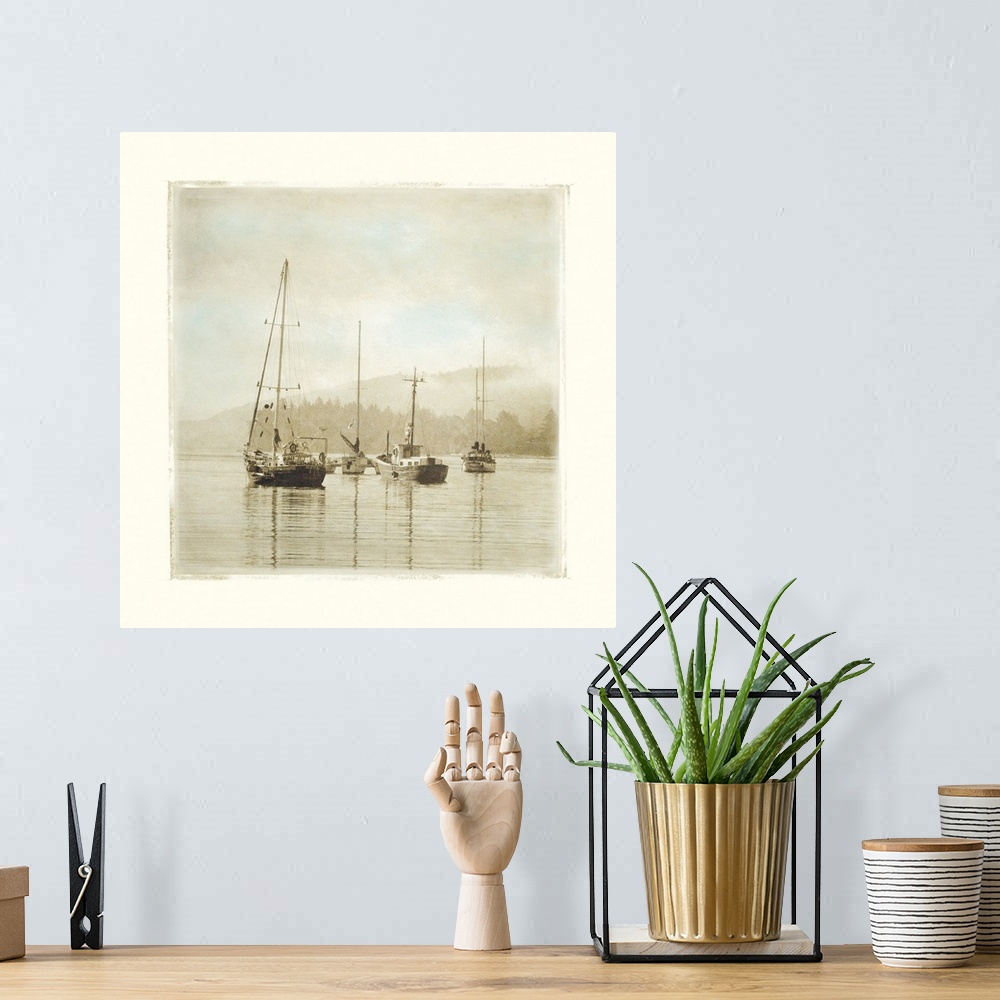A bohemian room featuring Painting of sailboats sitting calmly in the harbor waters.