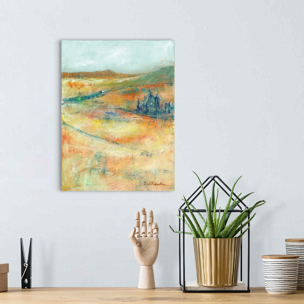 A bohemian room featuring Colorful abstract painting of a hilly landscape.