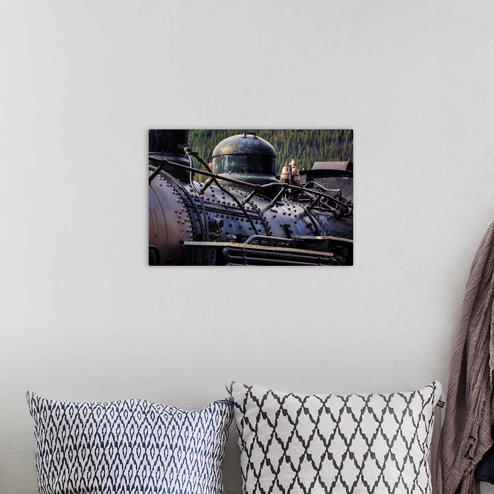 A bohemian room featuring Photograph of an old train engine in a rail yard.