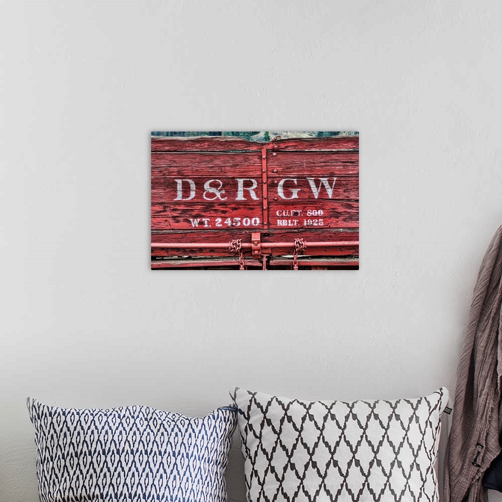 A bohemian room featuring Close up photo of detail and lettering from a vintage train car.