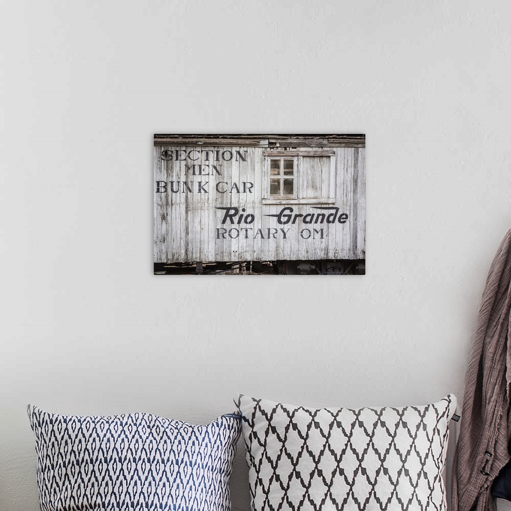 A bohemian room featuring Close up photo of detail and lettering from a vintage train car.
